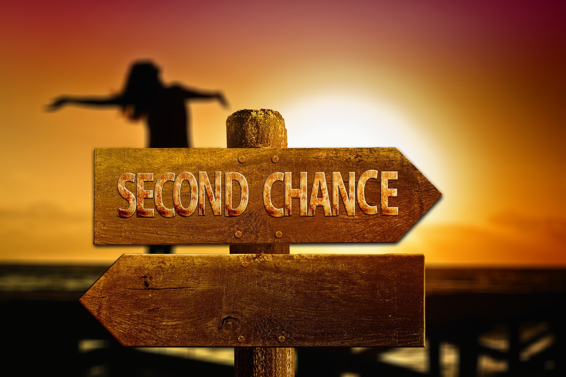 directional sign pointing to second chance