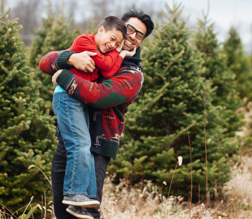 dad and son at Christmas tree farm