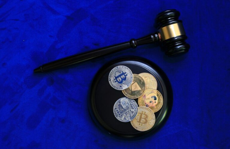 photo of bitcoin and judge's gavel